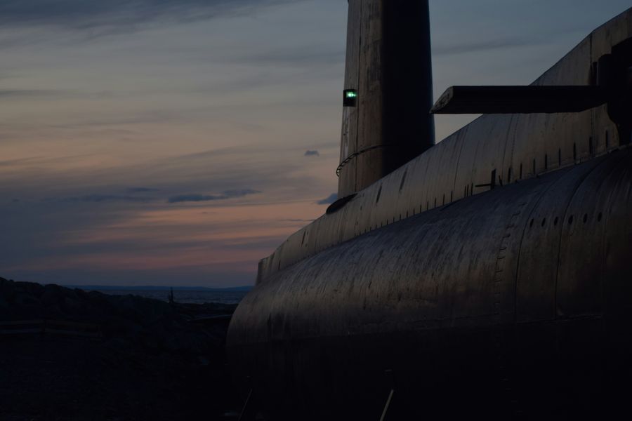 A submarine hull and fin at dusk